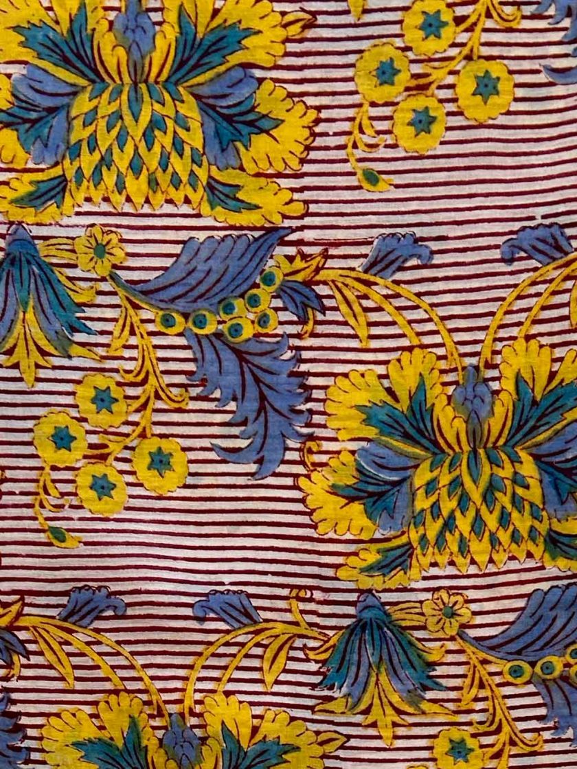 flor-raya-pareo-rojo-azul-amarillo